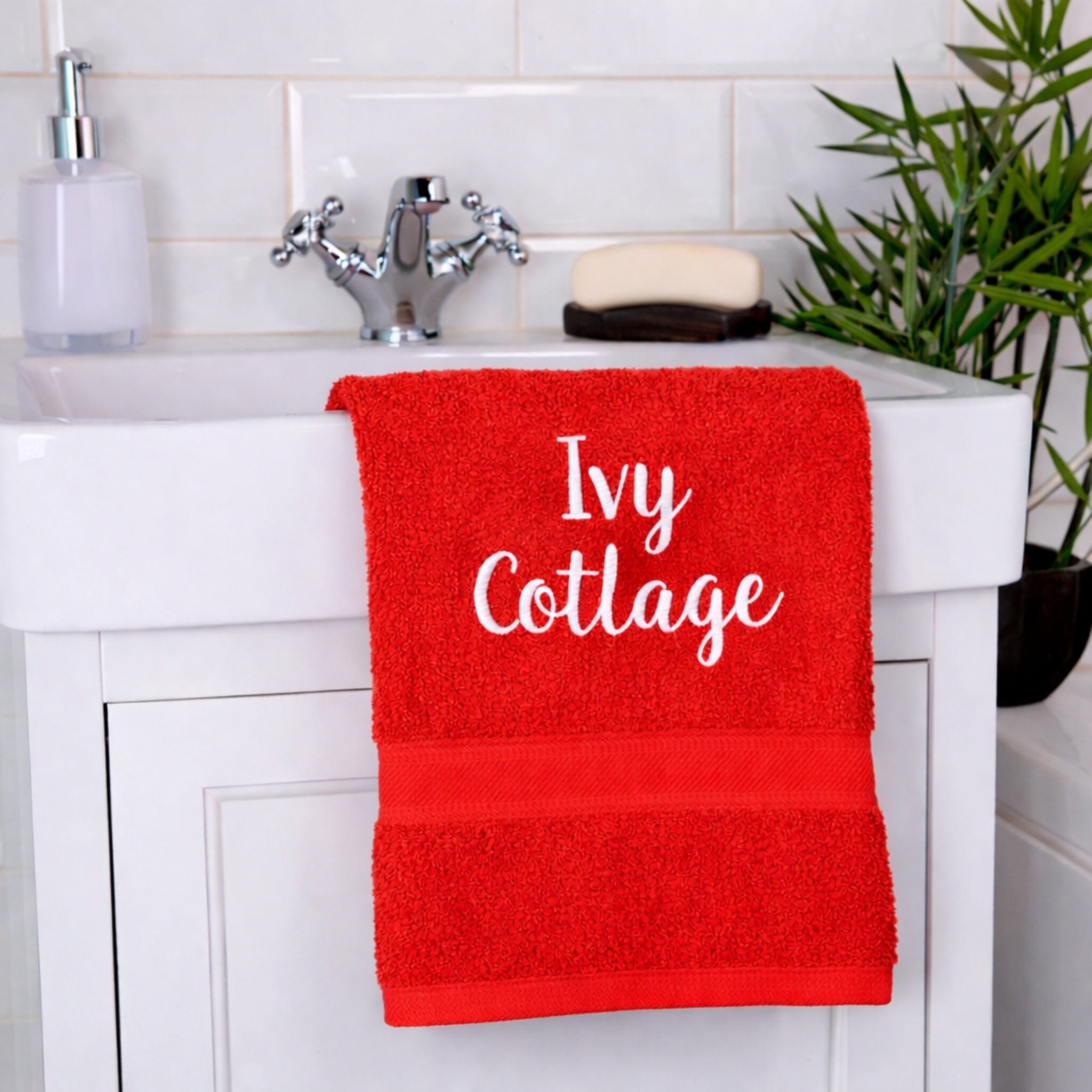 name on red hand towel