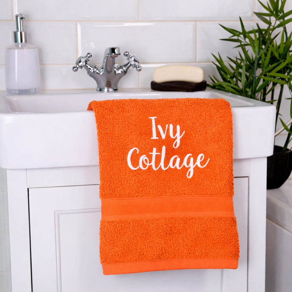 name on orange hand towel