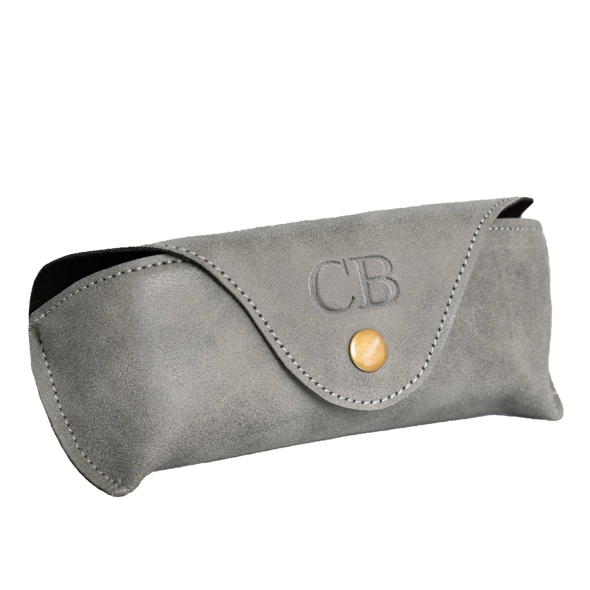 A grey Nu-Hide personalised eyeglasses case with a flap closure, debossed initials 'CB' on the front, a gold snap button, and visible contrast stitching, shown on a plain white background.