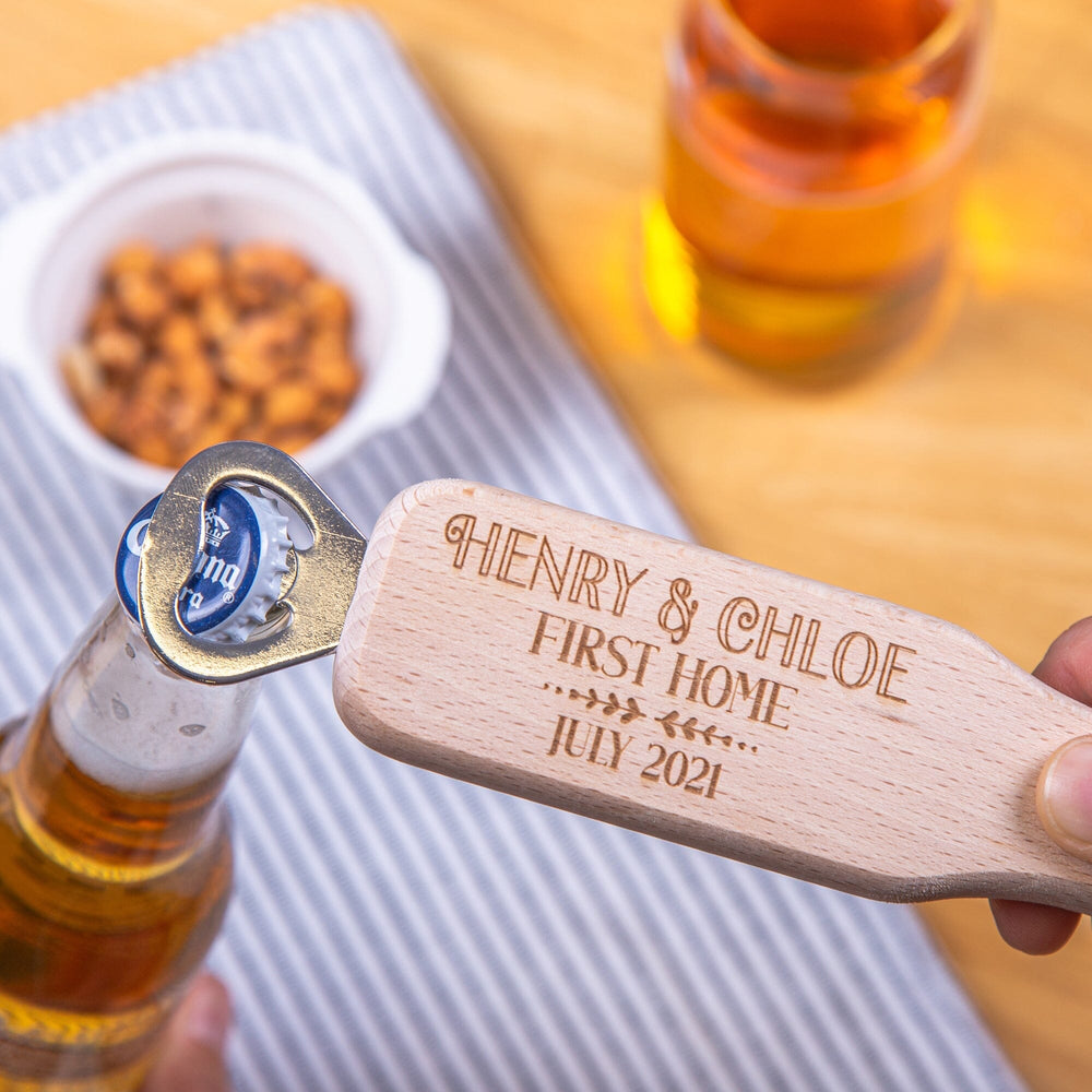 Personalised First Home Handled Bottle Opener nuts and beer in the backdrop