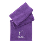 Personalised Purple towel folded on a plain white background with Embroidered fishing silhouette