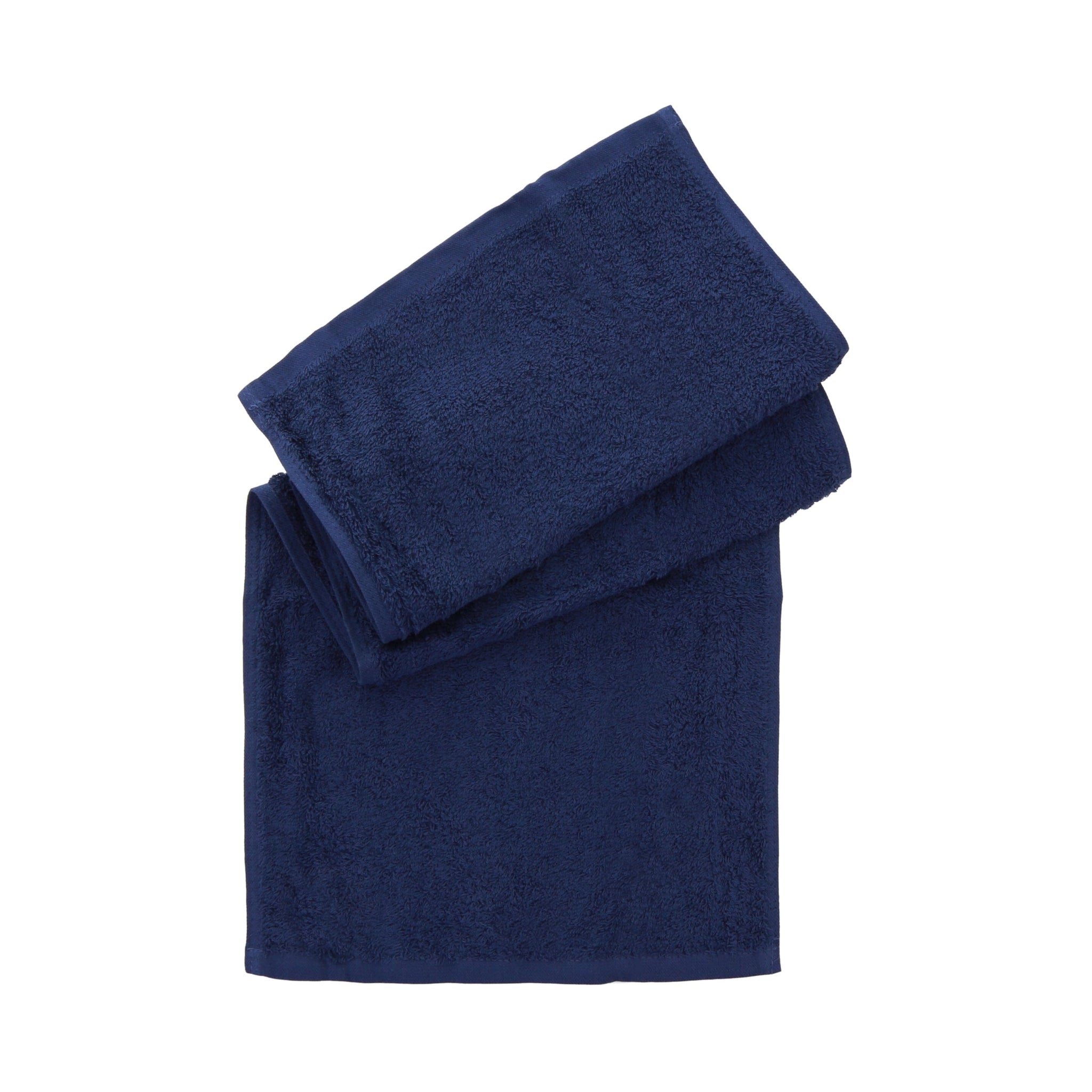Two folded navy blue towels stacked on a plain white background.