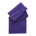 Two folded purple towels stacked on a plain white background, with the larger bath towel underneath and a smaller hand towel on top.