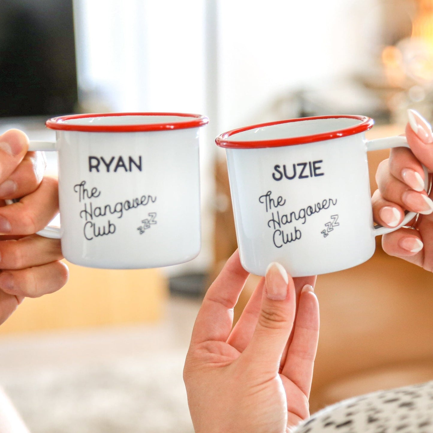 A couple holding Personalised Hangover Club Enamel Mug Set Of Two 