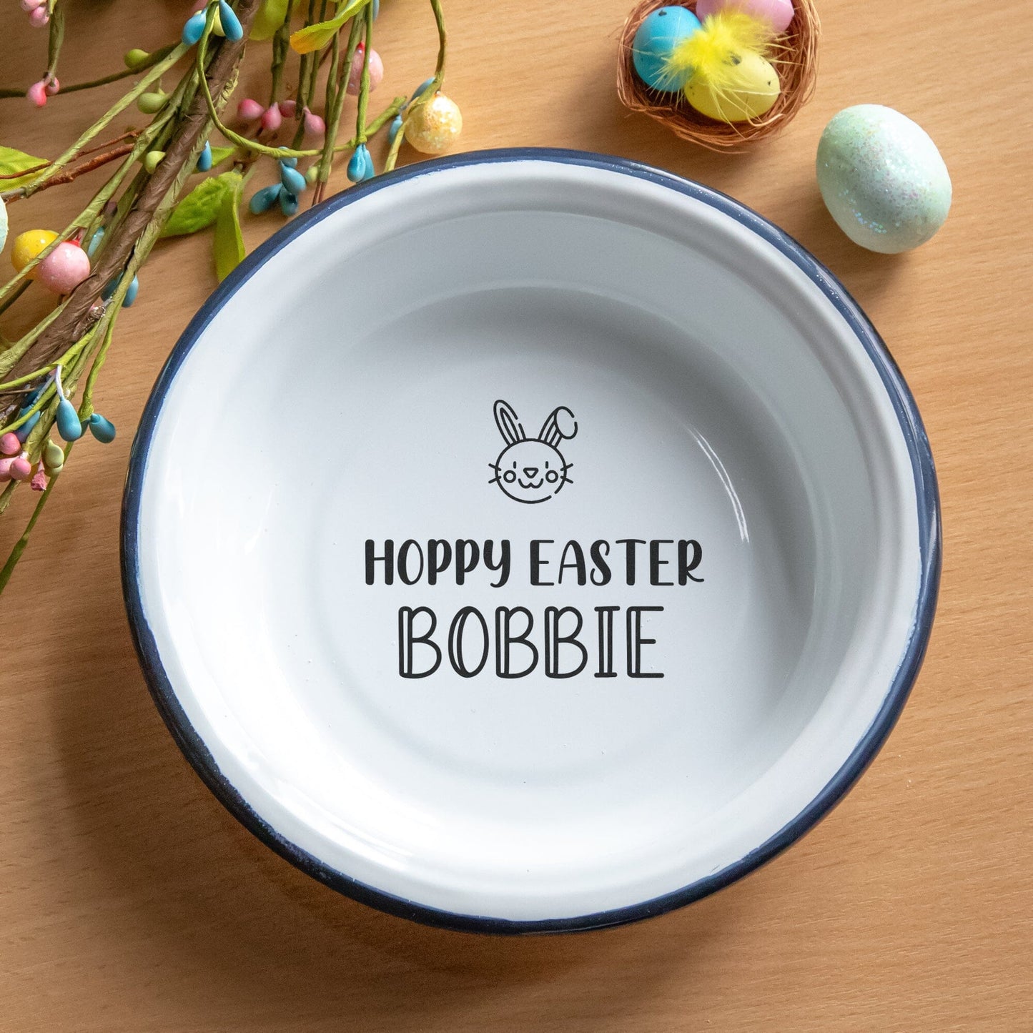 Personalised Hoppy Easter Enamel Bowl with easter decorations around