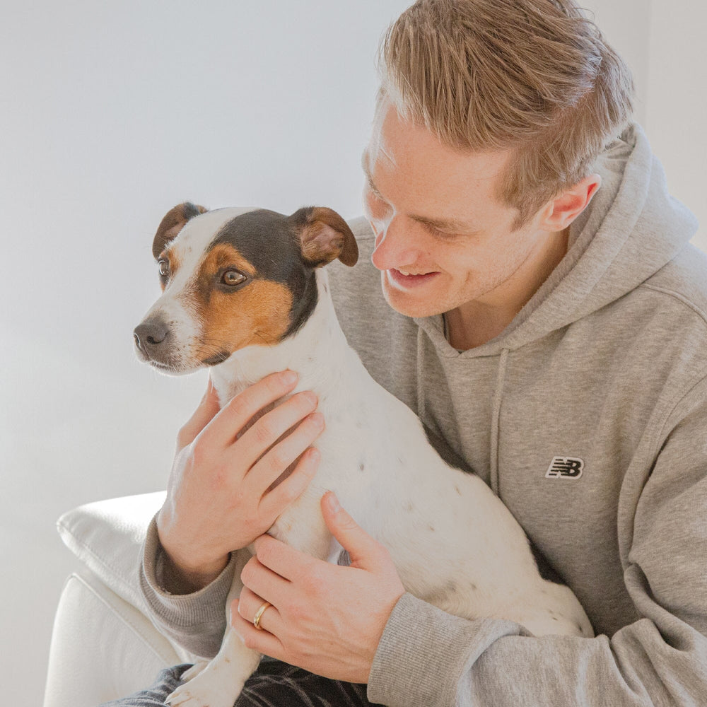 man holding a jack russel