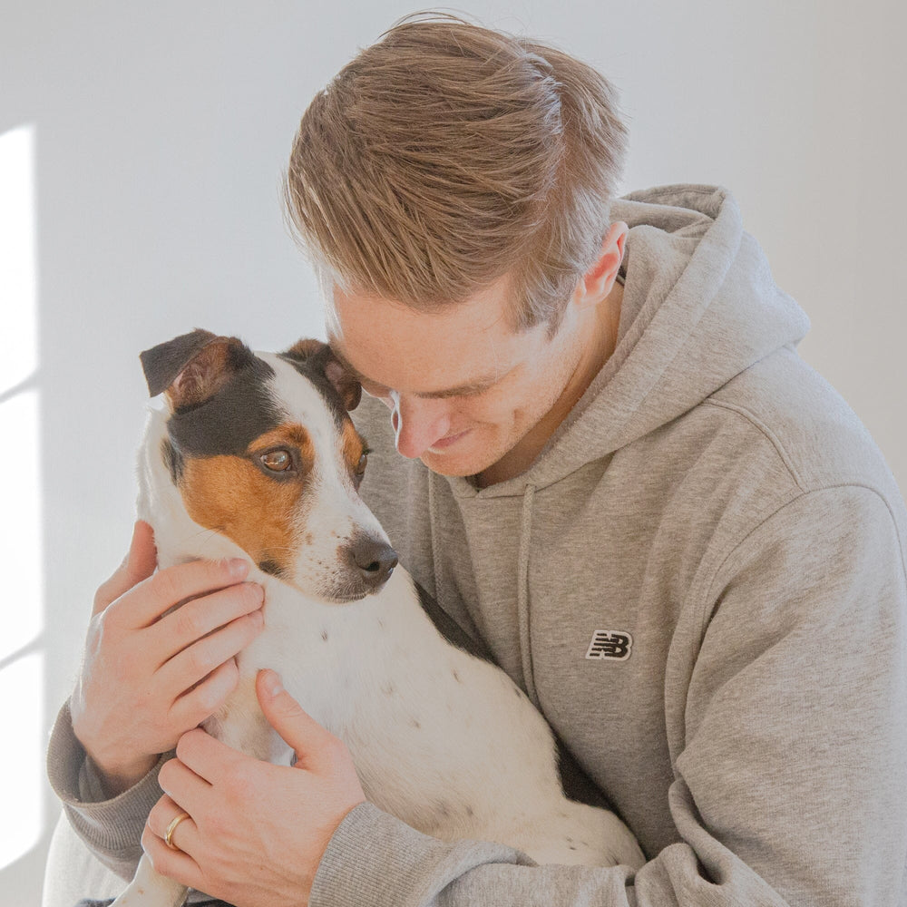 man holding a jack russel