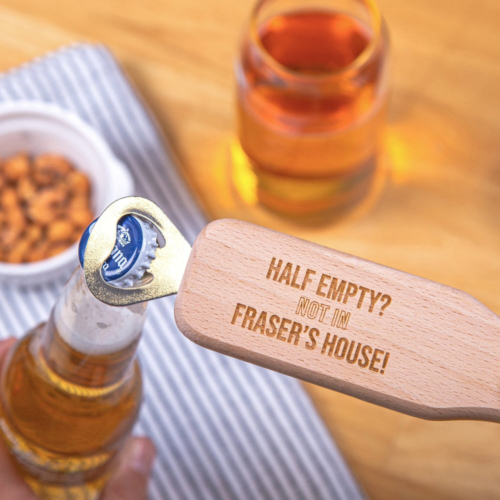Personalised Long Handled Bottle Opener opening a bottle cap, nuts and beer in the backdrop
