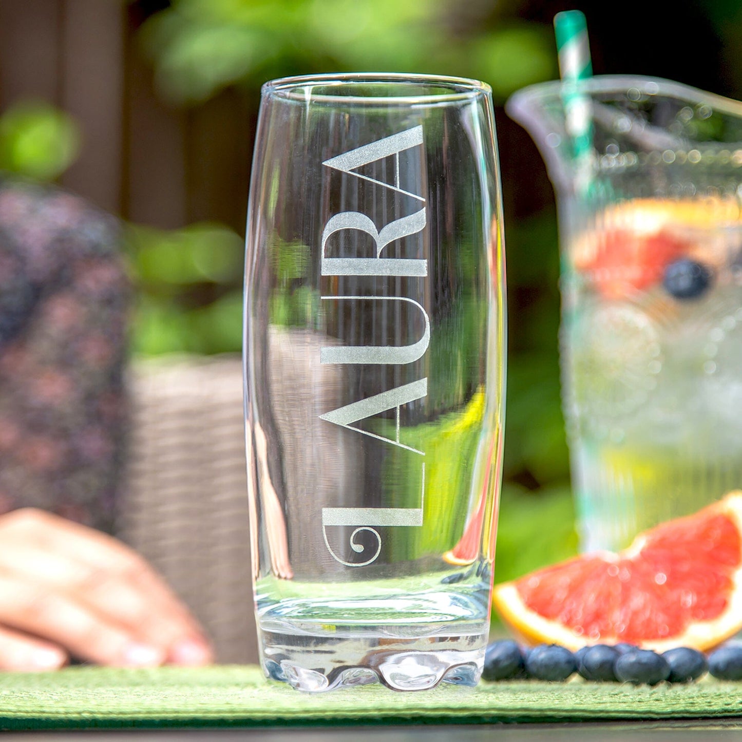 Personalised Name Hi Ball Glass Tumbler on a table in the garden