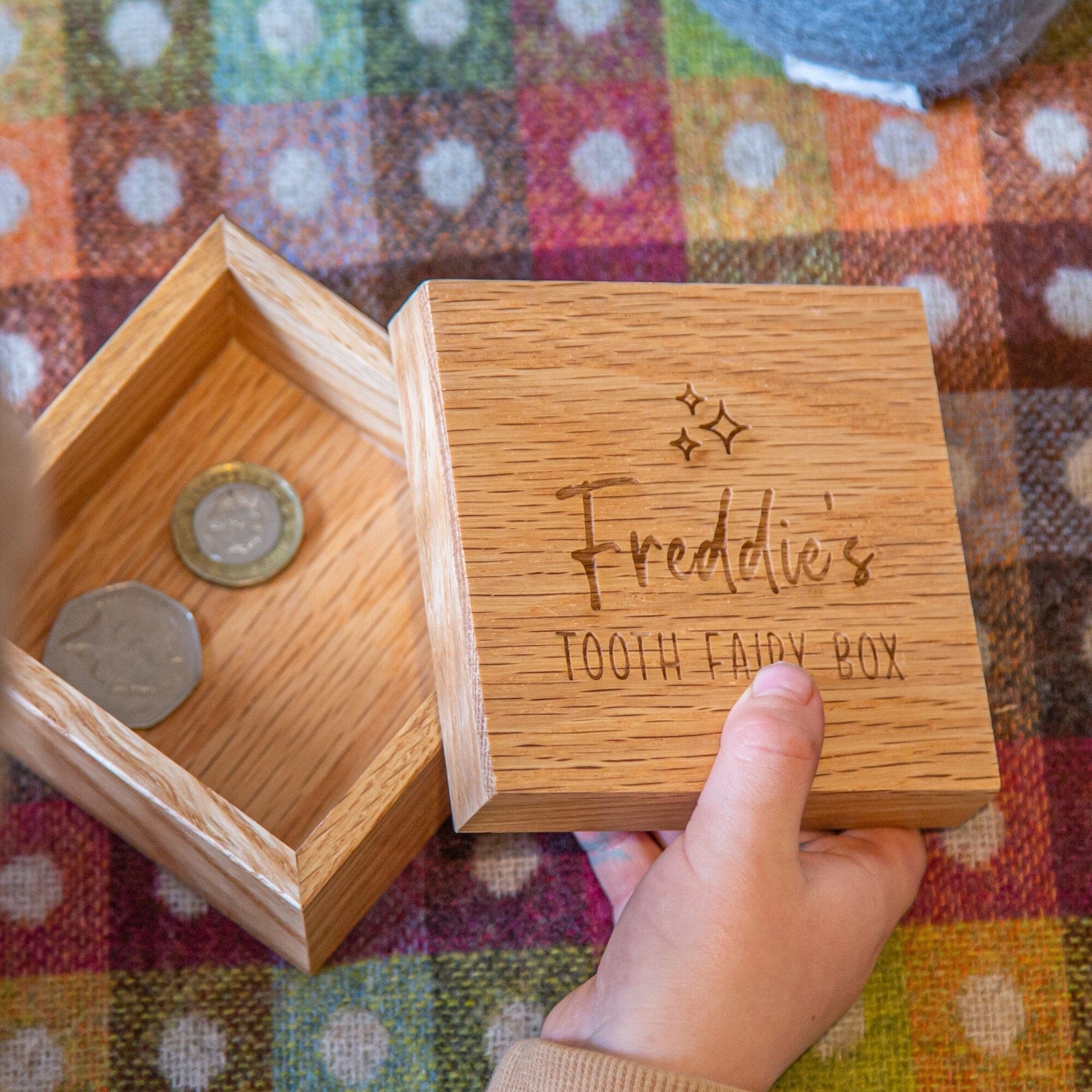 A kid opening the Personalised Oak Tooth Fairy Box 