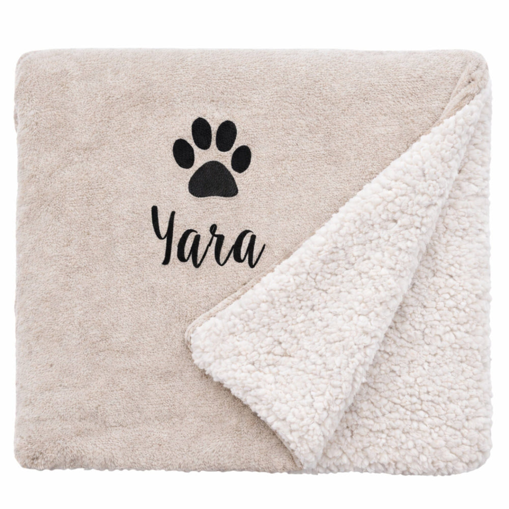 black text paw on taupe blanket