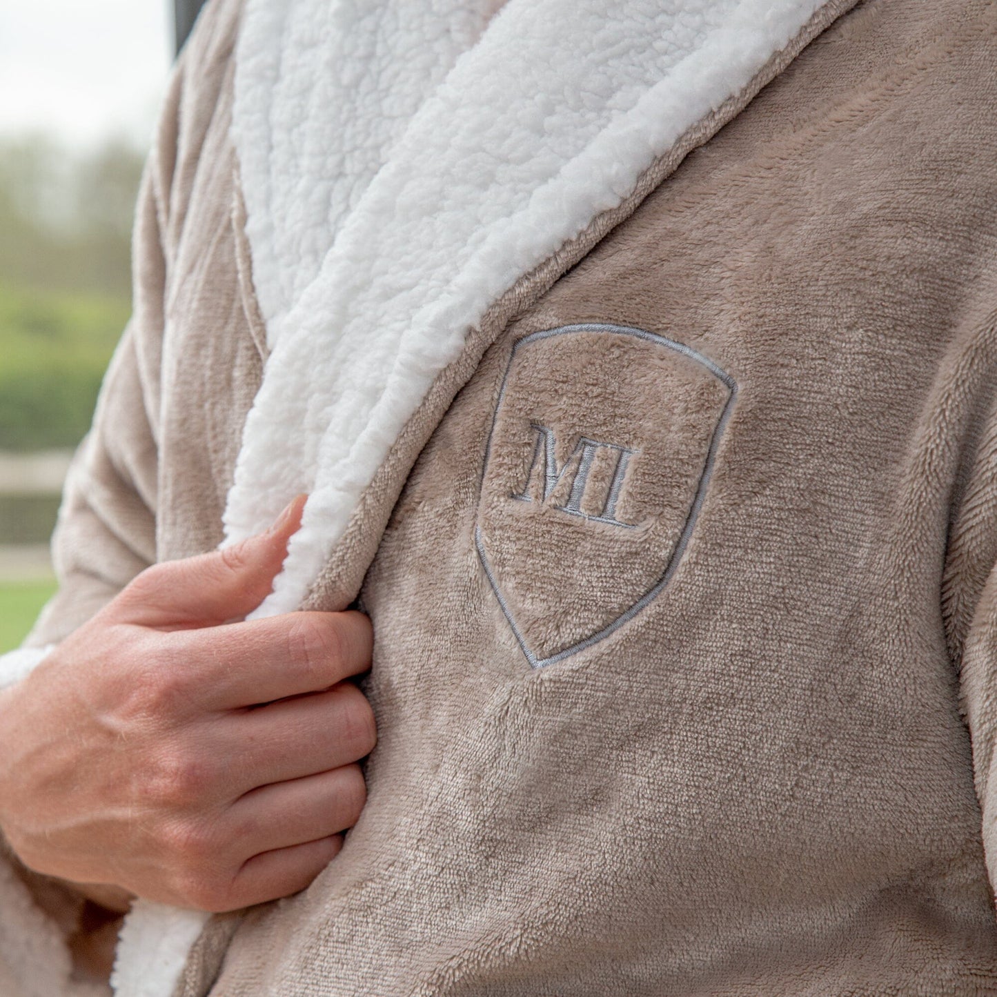 A male model wearing a taupe Personalised Sherpa Style Monogrammed Robe