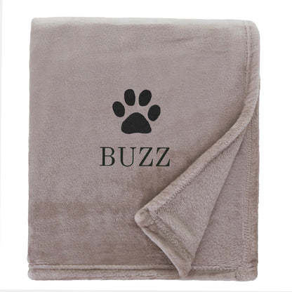 Natural Dog Throw with a pawprint design and personalisation of 'Buzz'