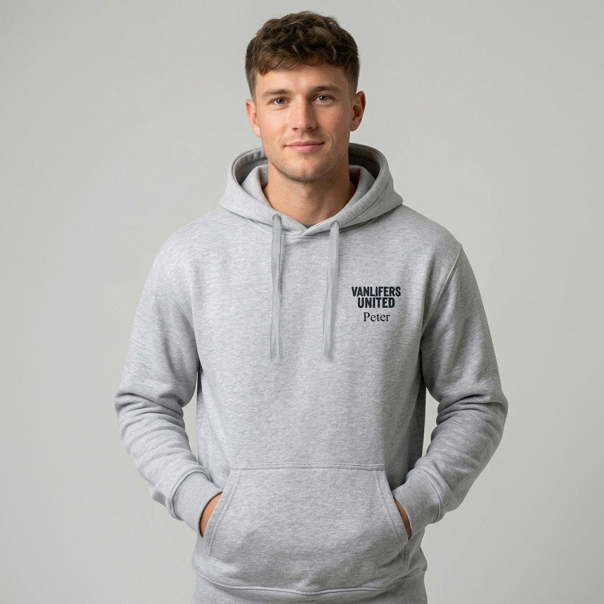 Grey hoodie with personalised Vanlifers United embroidery to the left chest worn by a male