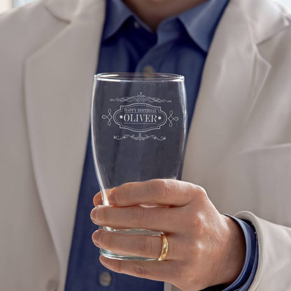 man holding glass with vintage style label