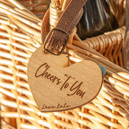 Closeup of the heart-shaped personalised cherry wood veneer tag