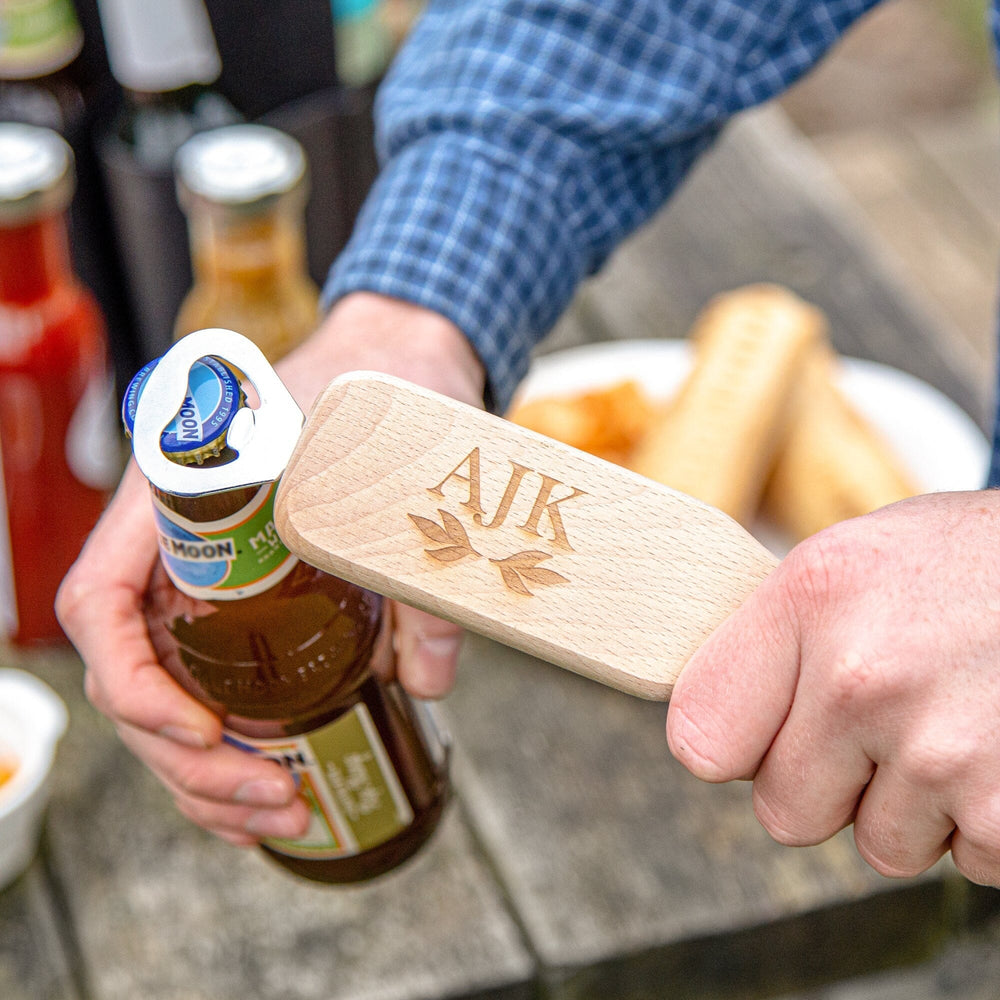 Opening a bottle with the Personalised Wooden Bottle Opener With Initials   