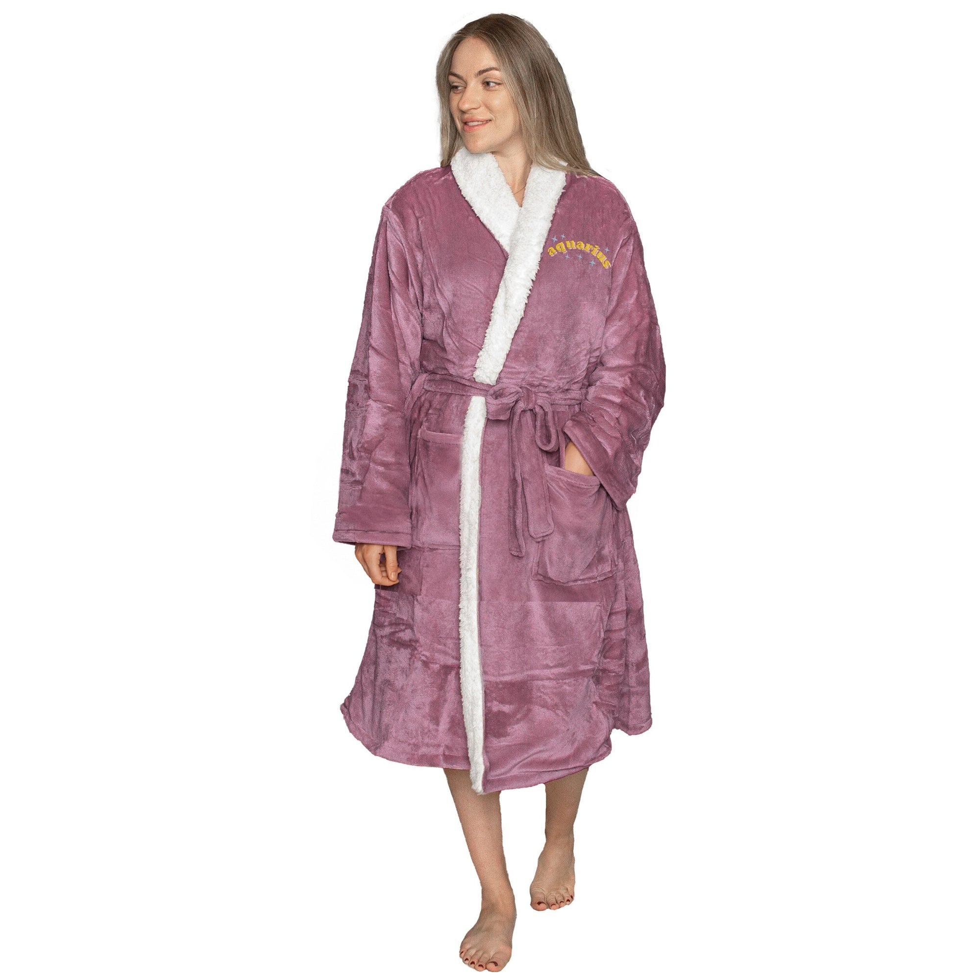 Woman wearing a sherpa Lavender robe with embroidered sparkle zodiac name, white lining on a white background