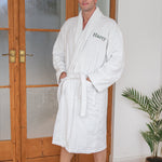 man wearing a personalised white bathrobe