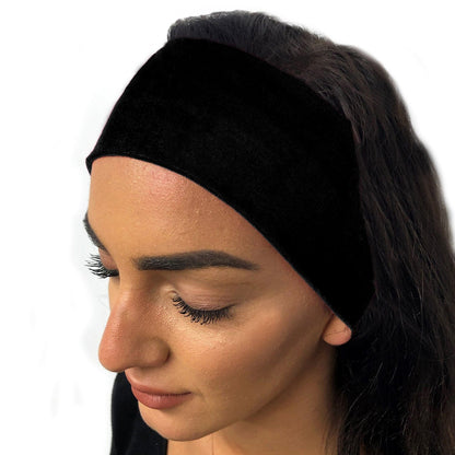 woman wearing a black towelling headband