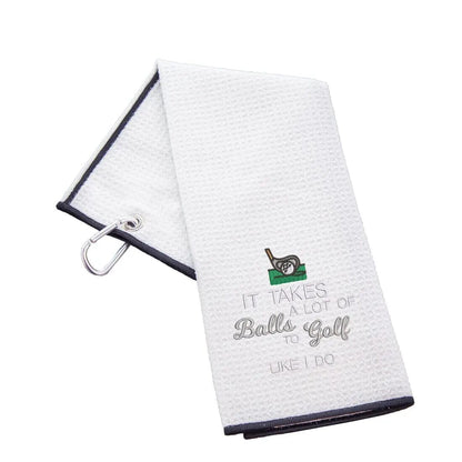 tri-fold-golf-towel-embroidered-with-takes-a-lot-of-balls-logo