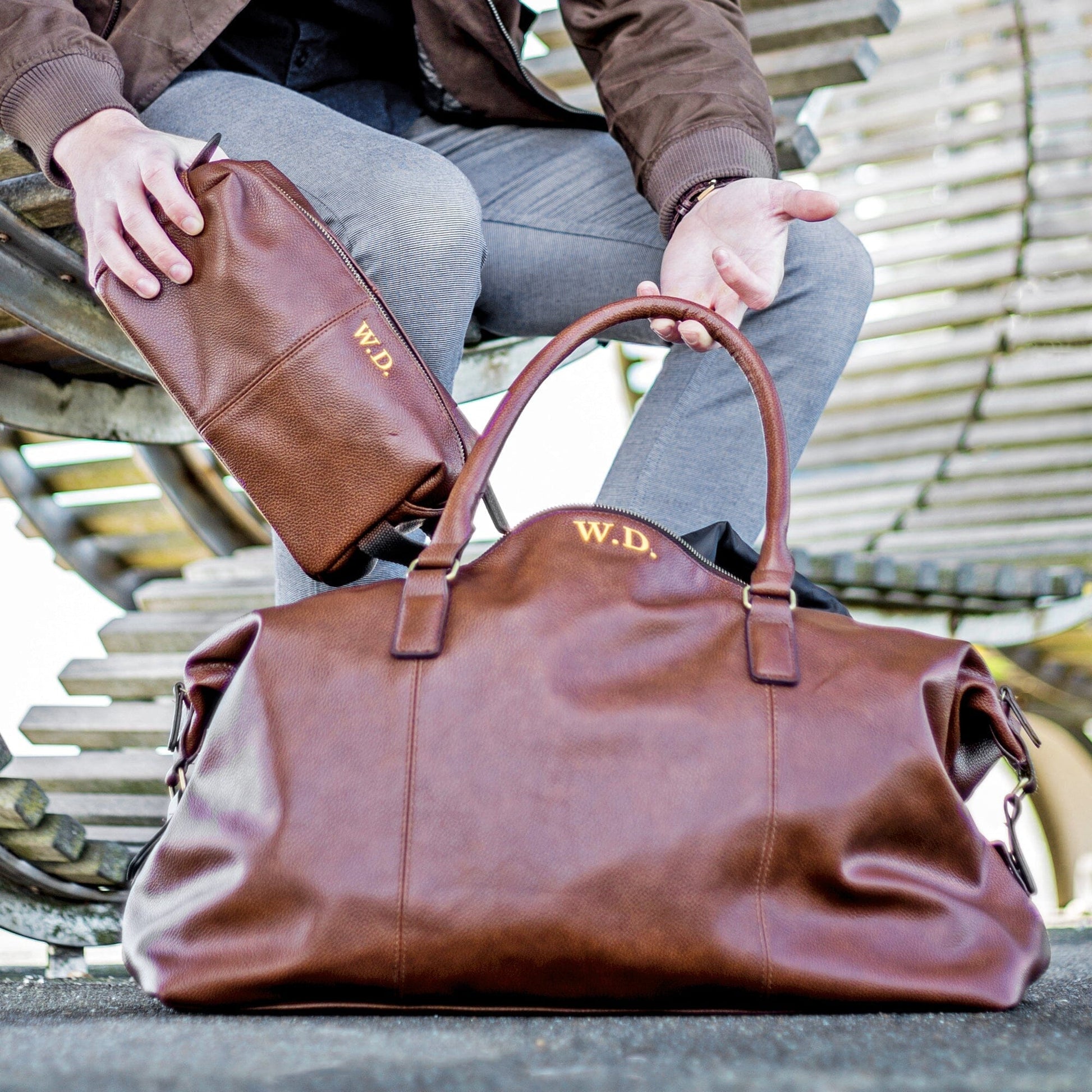 Personalised vintage holdall and wash bag set brown in a park