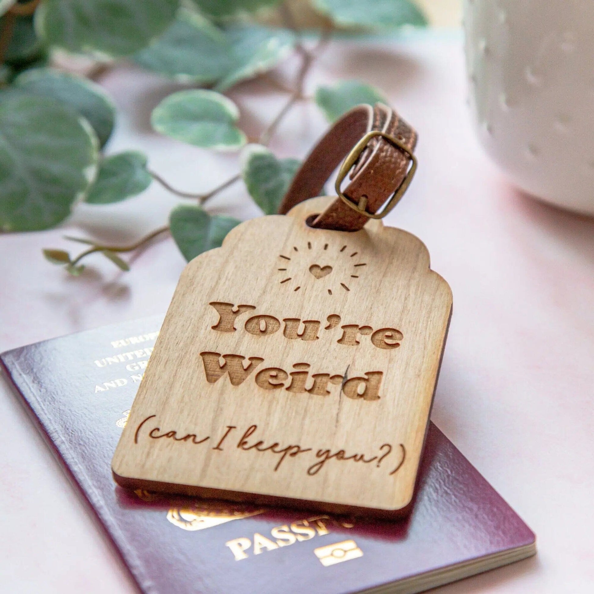 engraved luggaged tag with passport ready to be used, including a personalised messaged