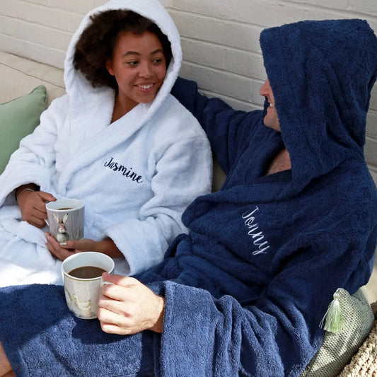 Lifestyle shot of a couple wearing the embroidered robes