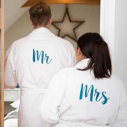 couple wearing a mr and mrs pair