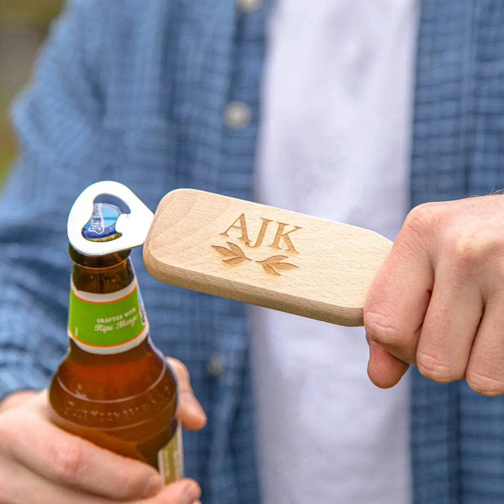 Opening a bottle with the Personalised Wooden Bottle Opener With Initials   