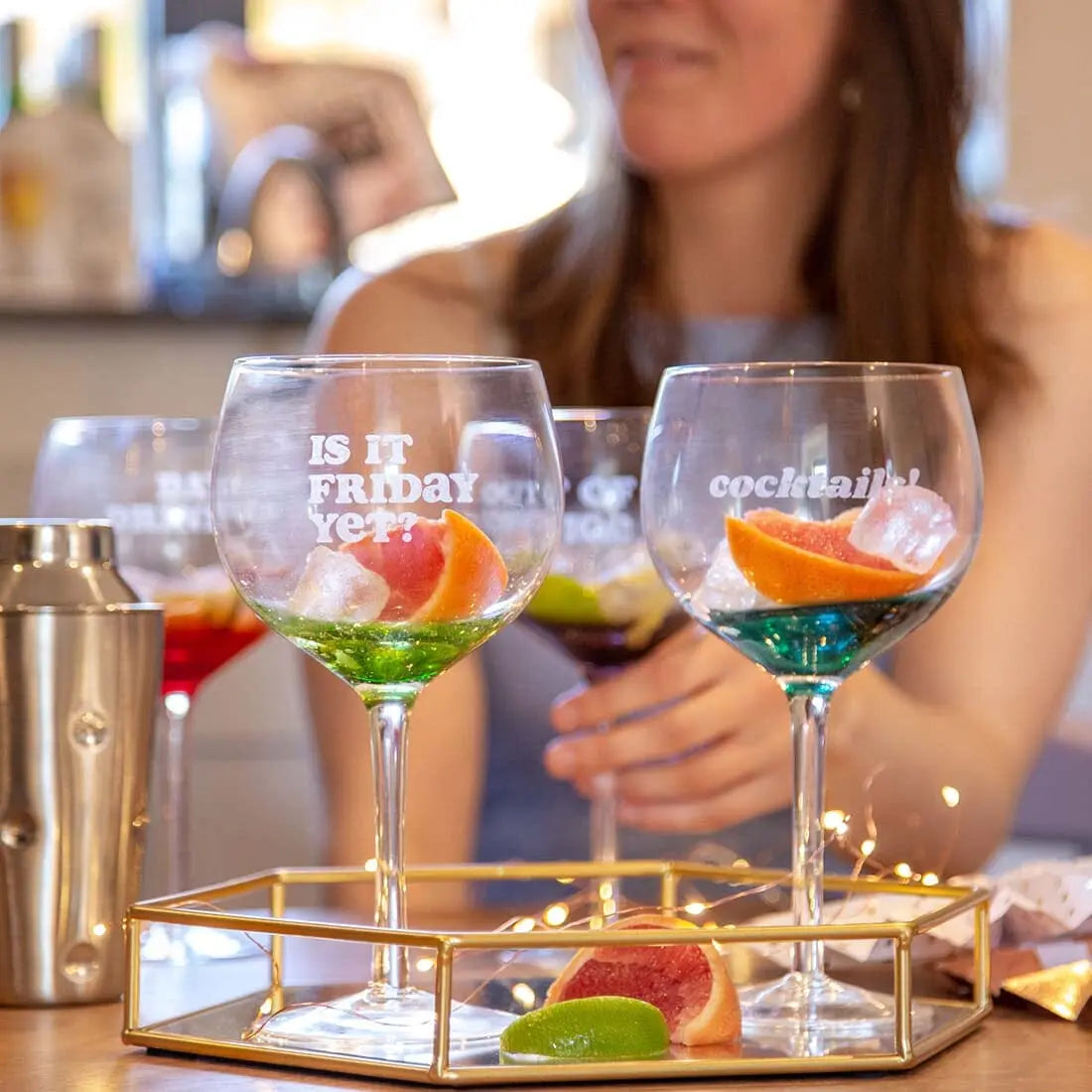 Set Of Four Coloured Gin Glasses With Phrases   